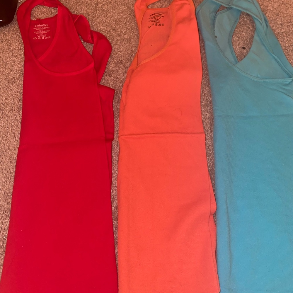 3 tanks- red, orange and blue. Slim fit but very stretchy and soft!